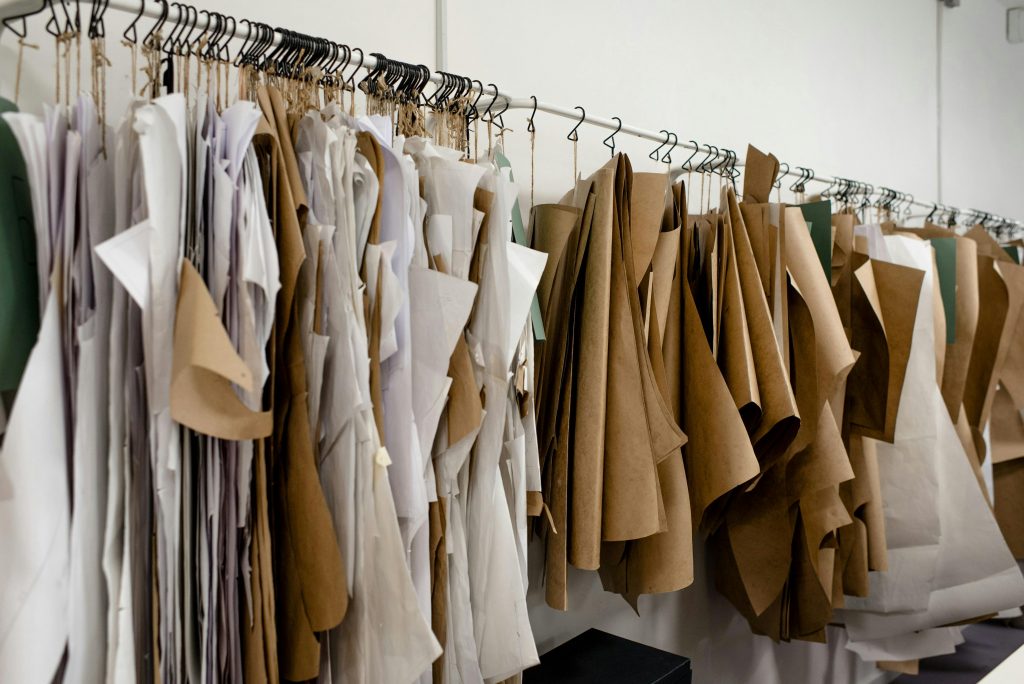 Organized sewing patterns in a fashion designer's studio, ideal for tailoring or design concepts.